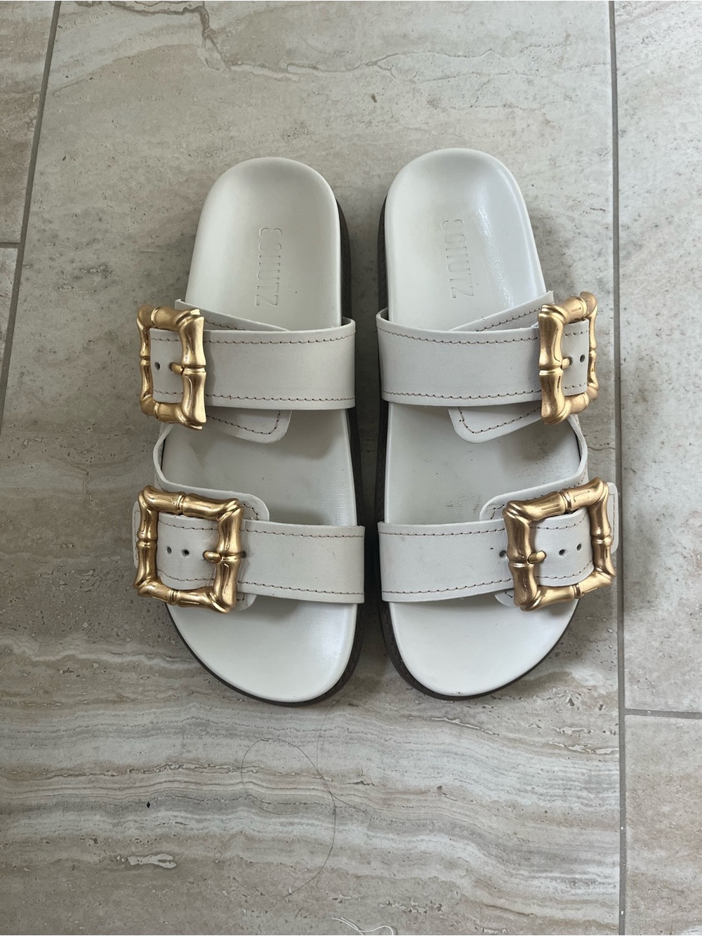 SCHUTZ White Slide Sandals with Gold Buckles